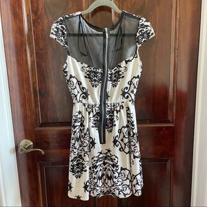 B. Darlin black and white dress with black mesh back. Size 9/10